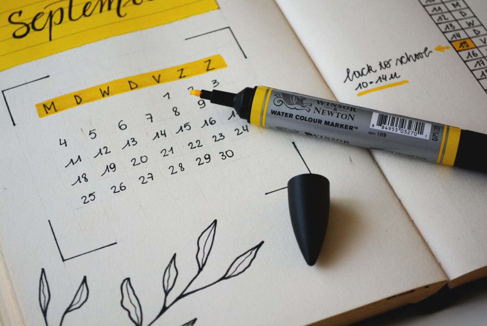 Paper 2022 nonprofit calendar with a yellow highlighter