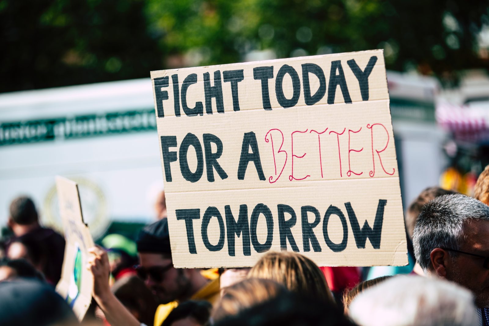 protest sign: "fight today for a better tomorrow"