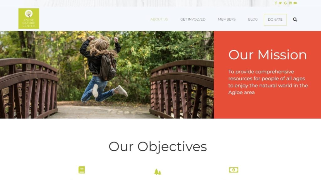 A nonprofit website's "Our Mission" page that features a photo of a young girl jumping for joy during a nature walk.