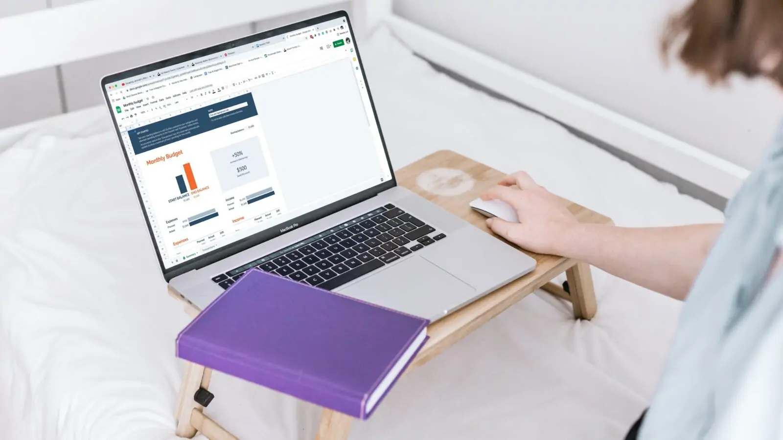 CRMs for nonprofits tie donor management, fundraising, email marketing, and events into a single all-in-one platform. In this image, a woman uses her laptop to run a report on her organization's monthly budget.