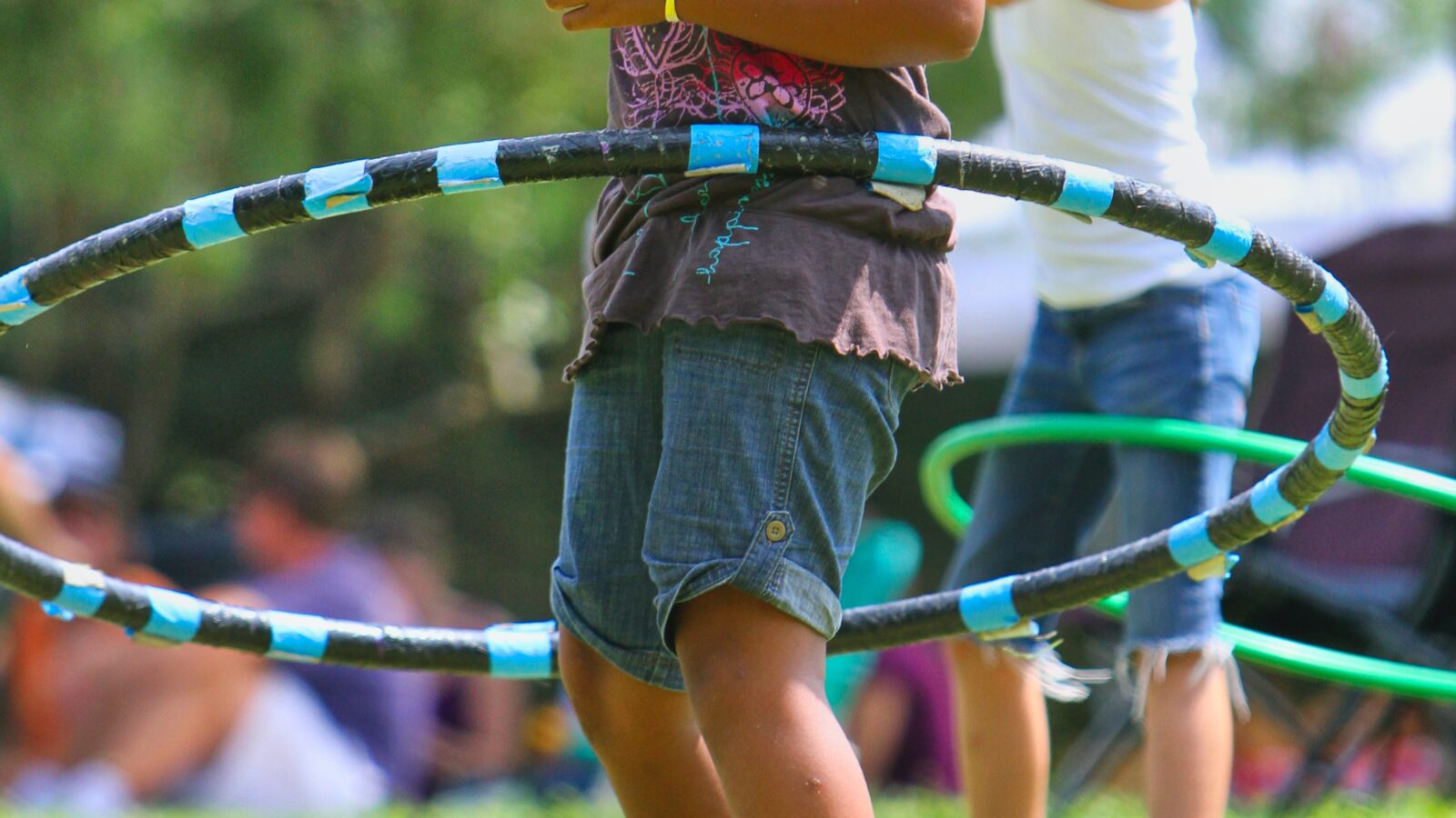 two girls hula hooping as part of a cheap fundraiser for a local nonprofit